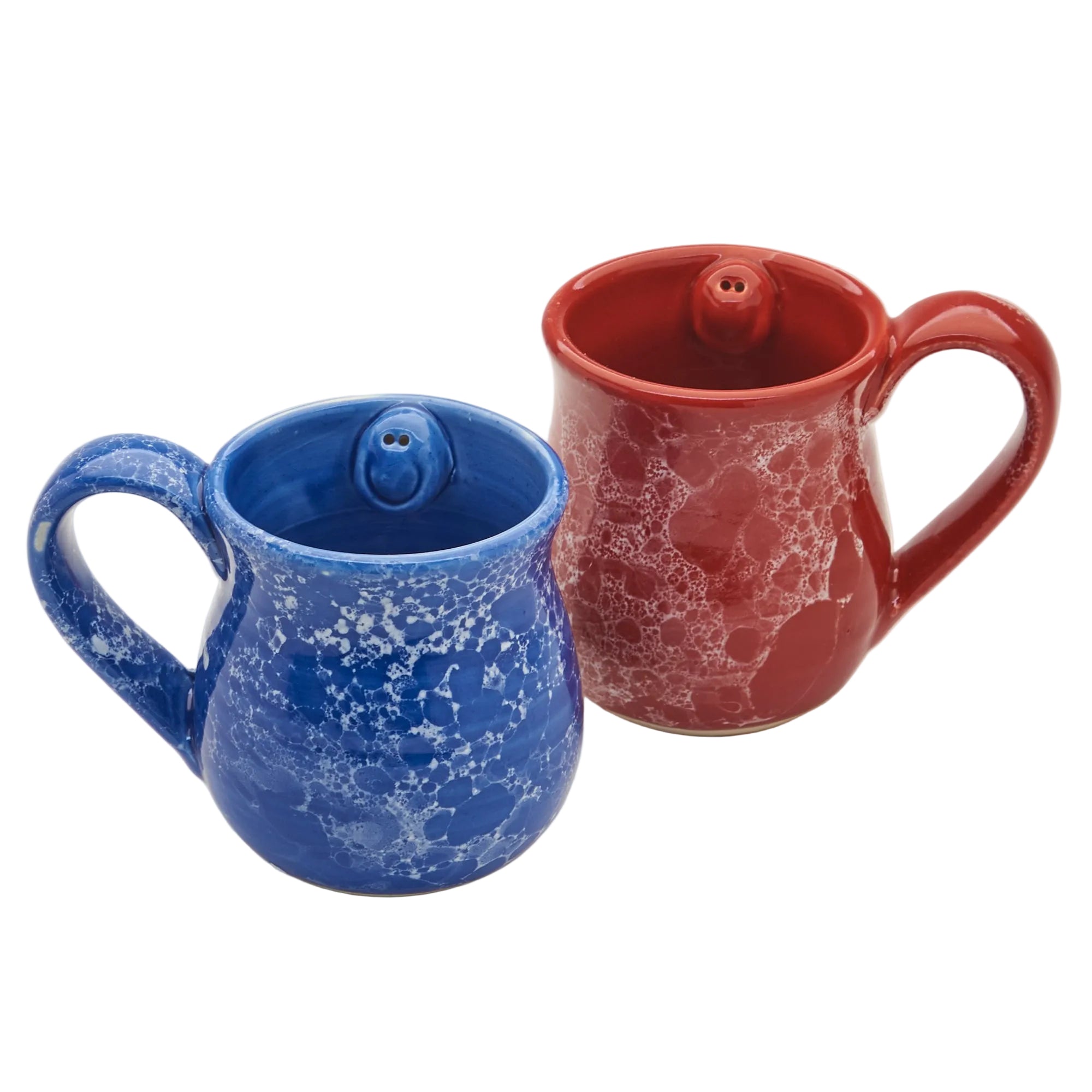 Two ceramic mugs, one blue with white speckles and the other red with a textured surface, on a white background.