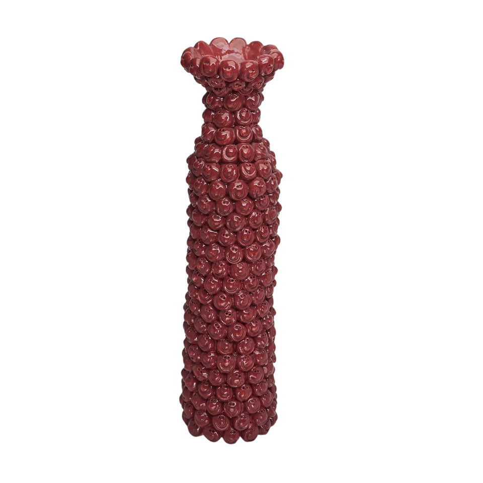 Decorative vase with smiles stacked on a white background